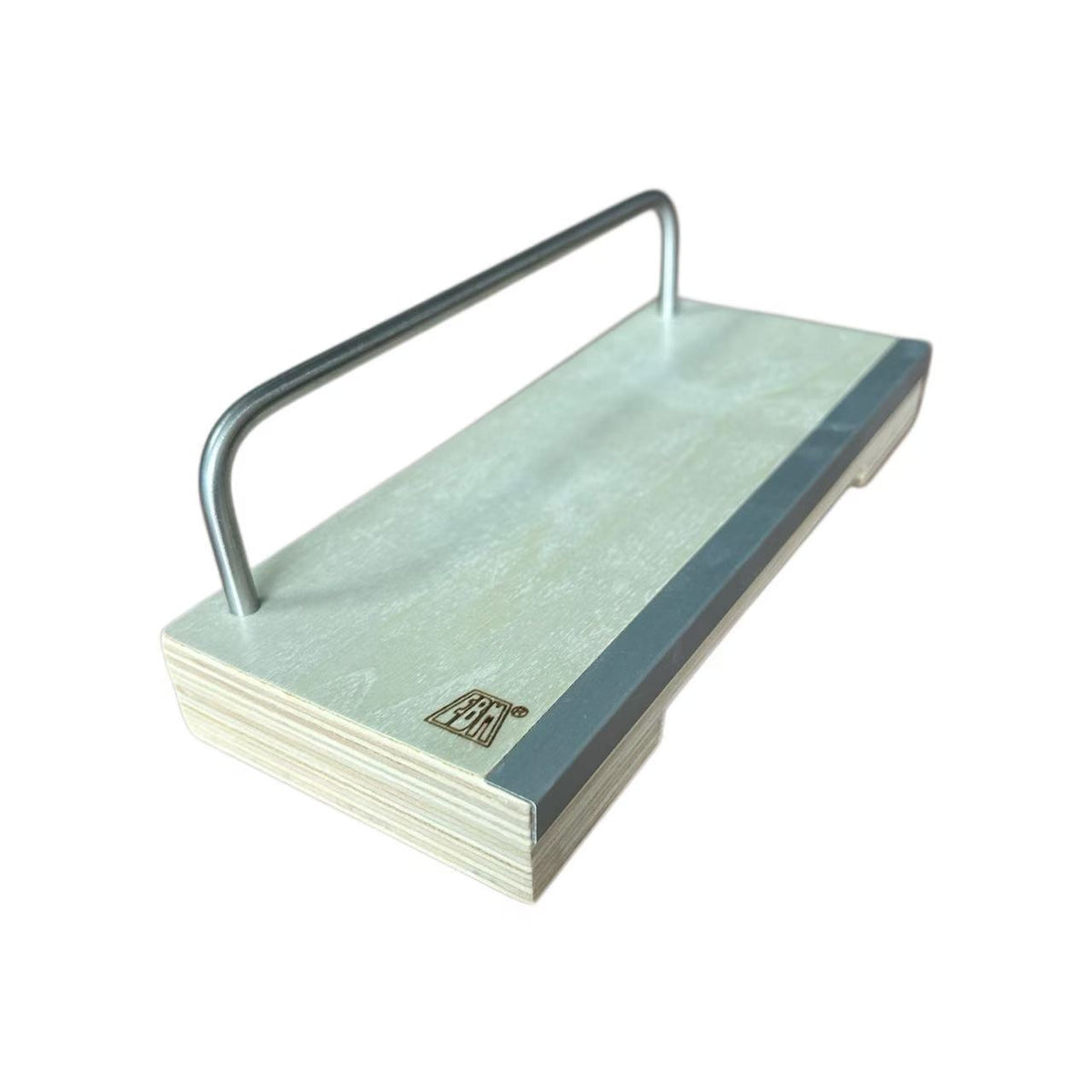 Detail view of wooden fingerboard grind rail, plywood base with metal rail, finger skate obstacle